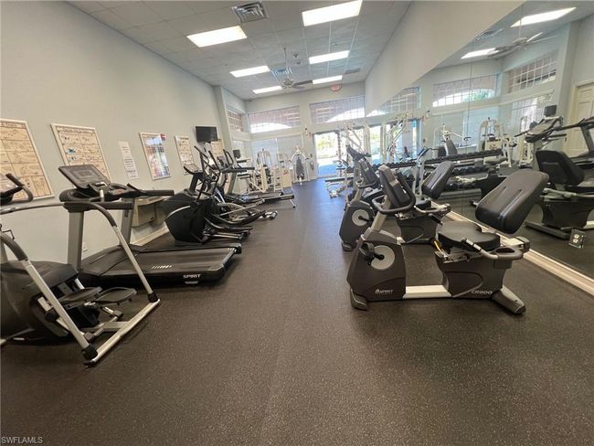 Gym featuring a paneled ceiling | Image 36