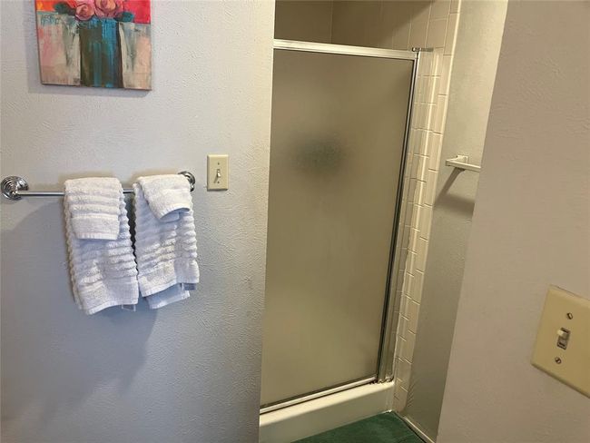 Bathroom featuring a stall shower | Image 13