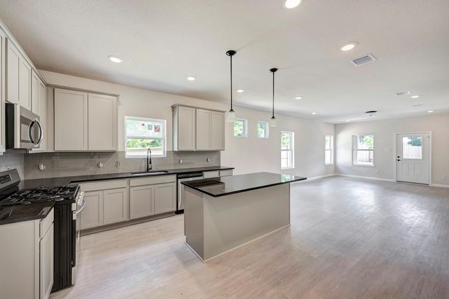 The Davenport II- Kitchen into Family Room. Home under construction. Sample floor plan photo used for illustrative purposes only. Upgrades, selections options, windows and colors may vary. | Image 4