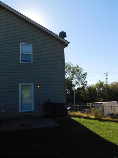 Rear view of property with a patio and a lawn | Image 2