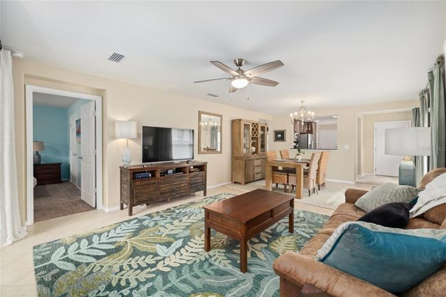 Comfort meets function in this spacious family room—perfect for relaxing or entertaining. | Image 10