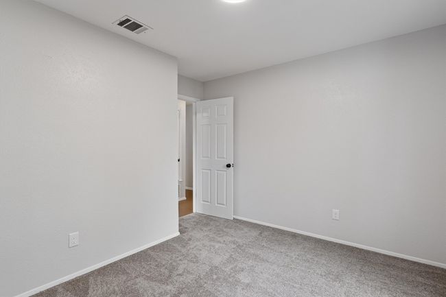 Empty room featuring carpet flooring and baseboards | Image 17