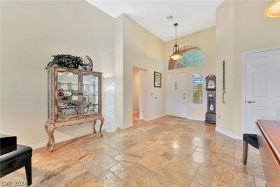 Travertine floors throughout living areas. | Image 3