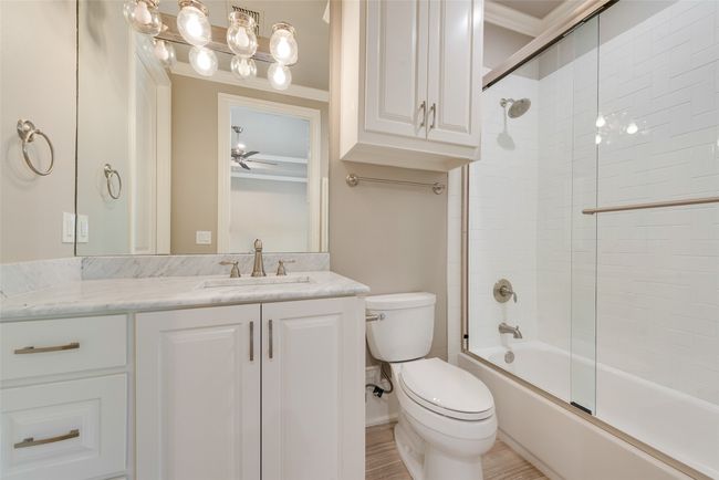 Full bath with crown molding, vanity, shower / bath combination with glass door, and toilet | Image 29