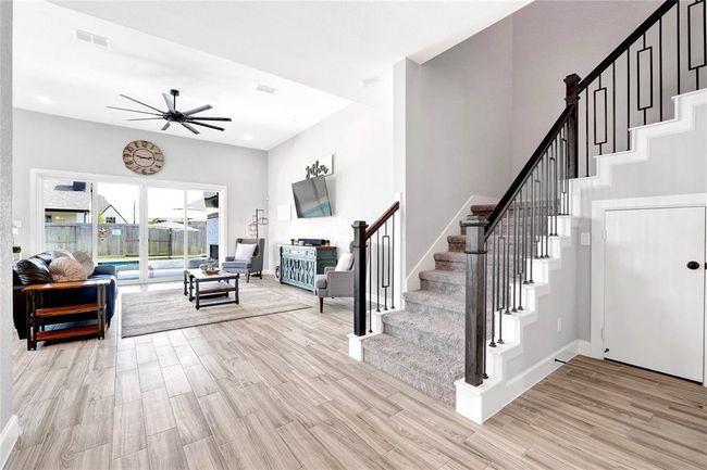 Extra storage under the stairs and privately located half bath downstairs to the right | Image 15