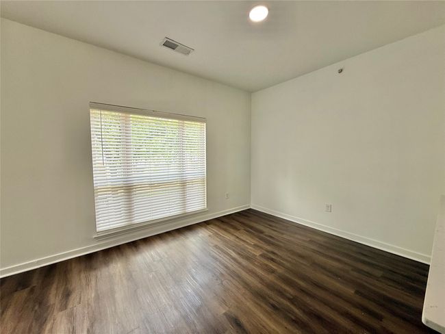 Unfurnished room featuring dark wood finished floors and baseboards | Image 10
