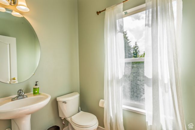 Half bathroom featuring a sink and toilet | Image 14
