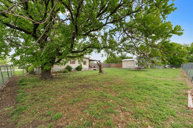 View of yard with an outdoor structure and a fenced backyard | Image 25
