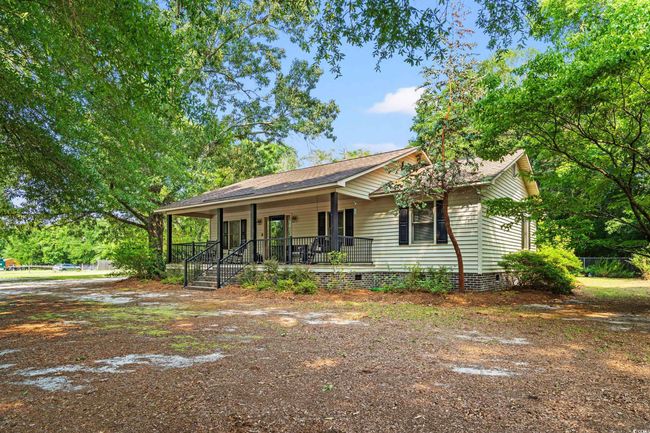 View of front facade featuring crawl space and a porch | Image 21