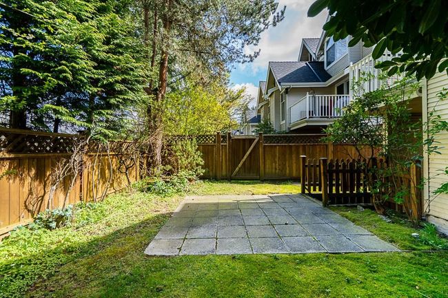 View of yard with a fenced backyard, a patio, and a gate | Image 31