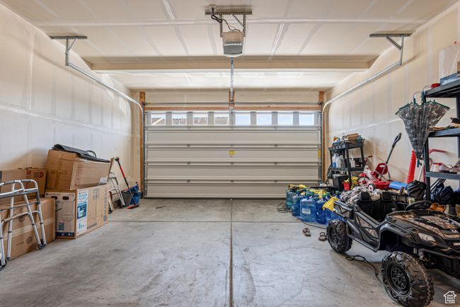 Garage with a garage door opener | Image 15