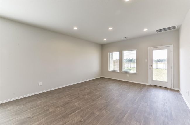 Spacious family room. | Image 10