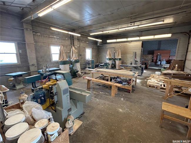 Garage featuring a workshop area | Image 24