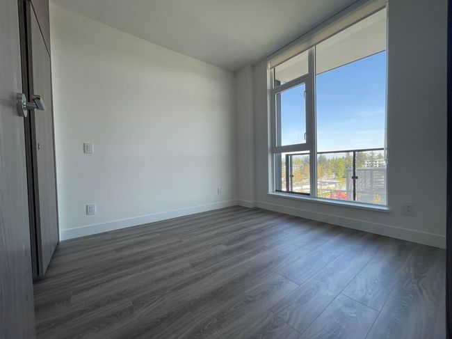 Unfurnished room featuring dark wood-style flooring and baseboards | Image 13