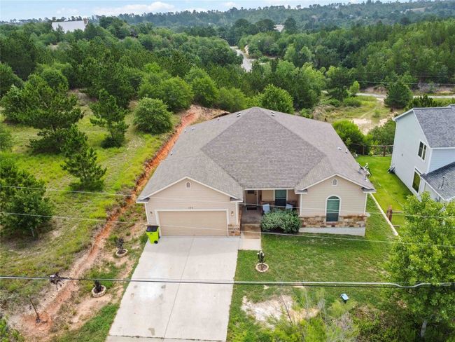 Aerial view of property and surrounding area featuring a forest | Image 31