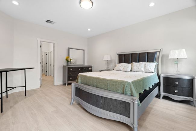 Bedroom featuring light wood-type flooring and recessed lighting | Image 21
