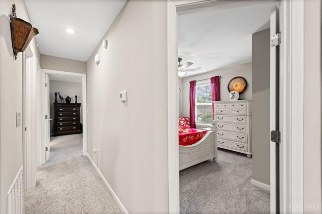 Large second bedroom with carpet, ceiling fan and generous closet size. | Image 20
