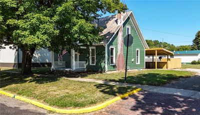 View of front of property featuring a front yard and covered porch | Image 3