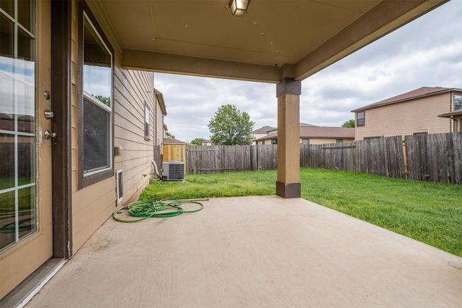 View of patio / terrace with a fenced backyard and central AC unit | Image 34