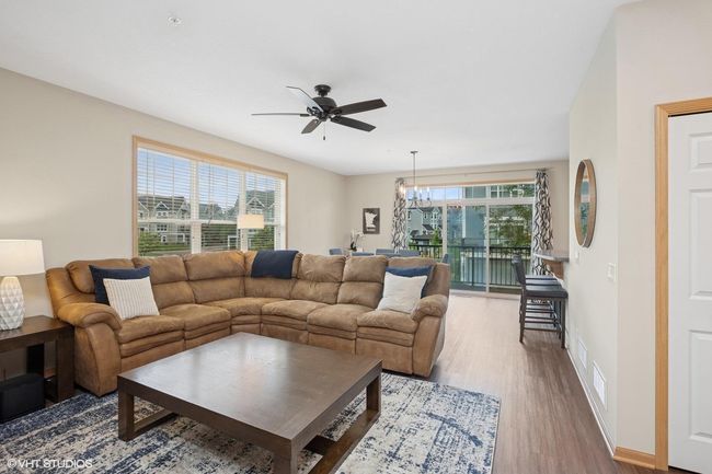 Great flow on the main level with the living room, dining room and kitchen | Image 9