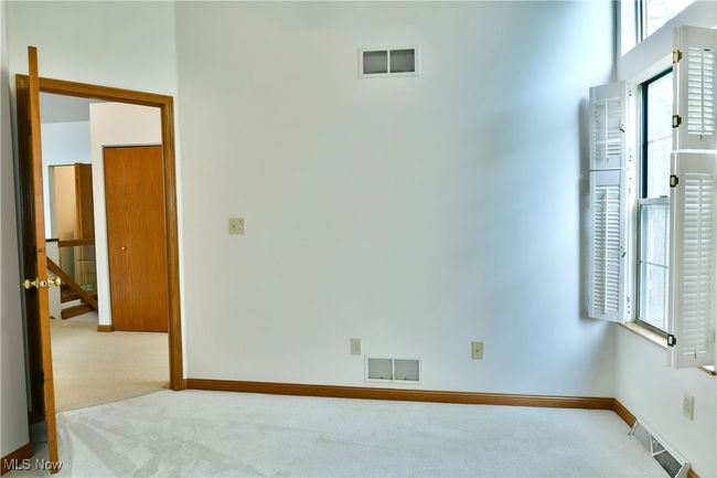 Spare room featuring carpet | Image 30