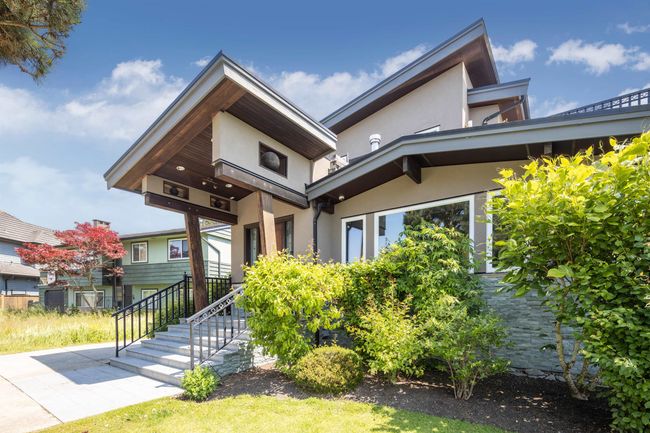 Contemporary house featuring stucco siding | Image 5