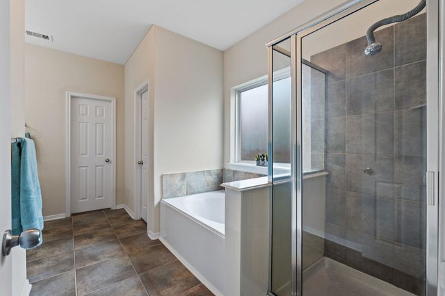 Wonderful en-suite with stand alone shower and soaking tub. | Image 21