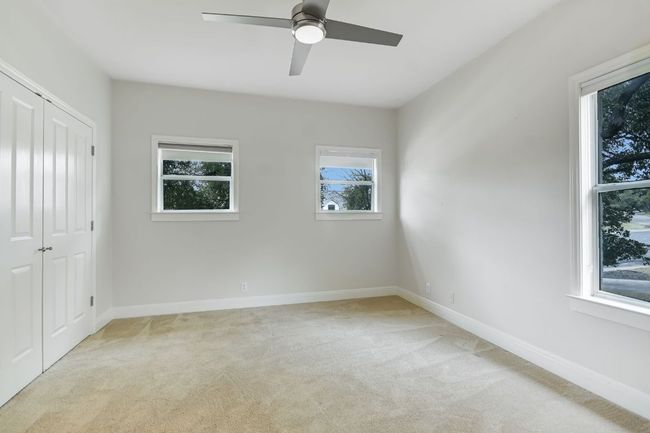 Bedroom located on the second level with natural light and nice storage. | Image 26