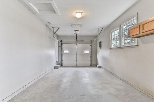 Garage featuring electric panel | Image 12