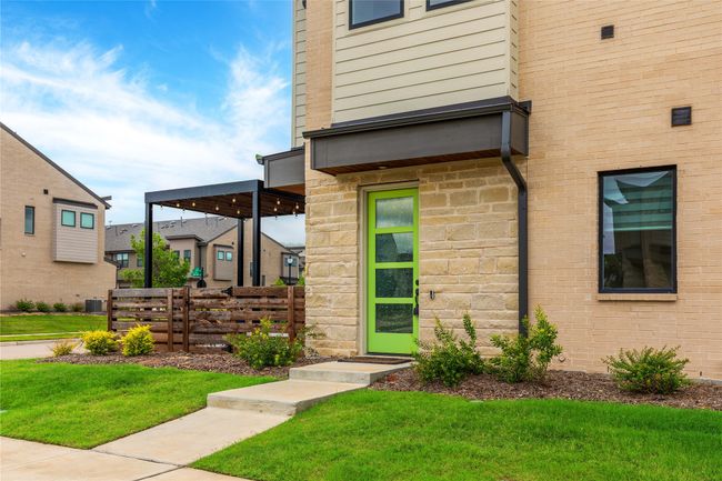 View of exterior entry with stone siding | Image 32