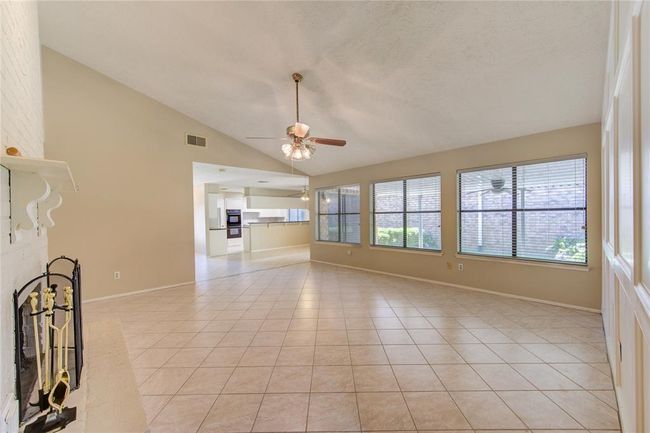 Family room - looking towards the dining room and kitchen. | Image 8