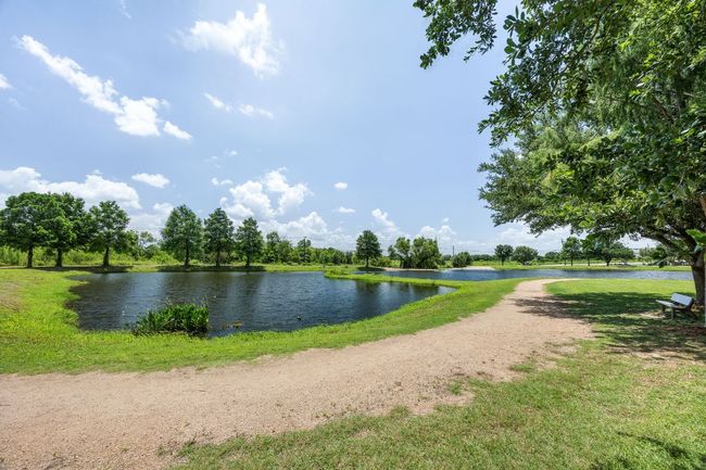 Small lake with walking path. | Image 36