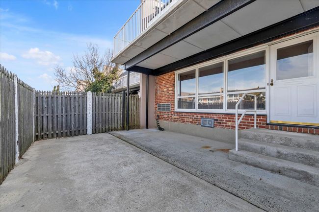 View of patio with entry steps and fence | Image 21