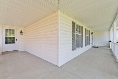 Wrap around covered front porch. Left side of porch provides access to the formal dining room. | Image 3