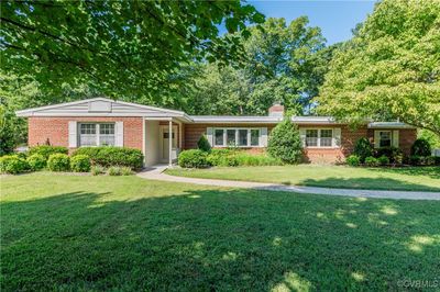 Single story home featuring a front lawn | Image 1