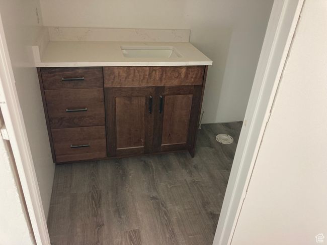 Bathroom featuring vanity and wood finished floors | Image 6