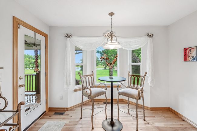 Dining room featuring healthy amount of natural light, light wood-style flooring, and baseboards | Image 5