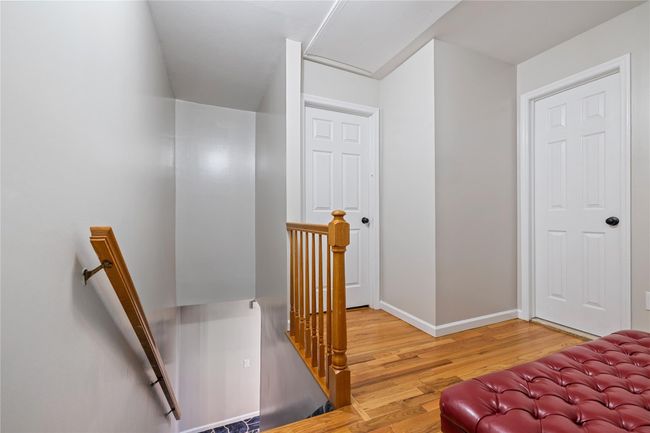Stairway featuring wood finished floors and baseboards | Image 30