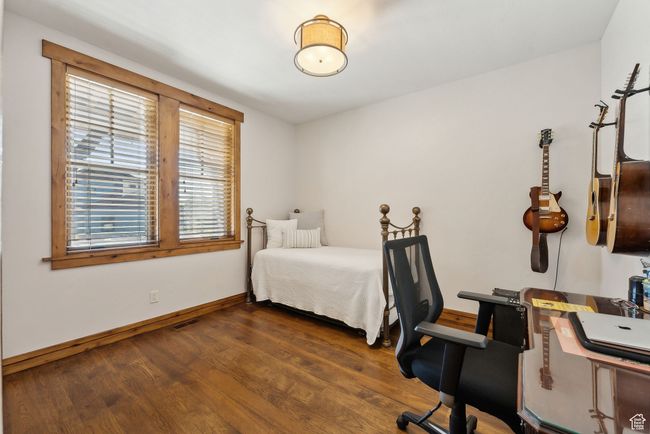Bedroom featuring baseboards and wood finished floors | Image 24