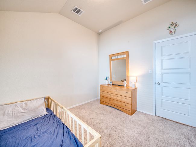 Bedroom featuring carpet flooring and vaulted ceiling | Image 15
