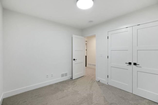 Lower level guest (4th) bedroom. Pictures of previously built house. | Image 27