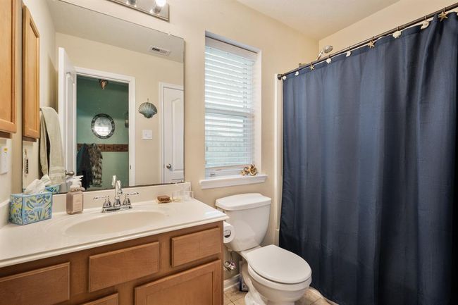 Secondary bathroom features atub/shower combo and vanitywith plenty of counter space. | Image 21