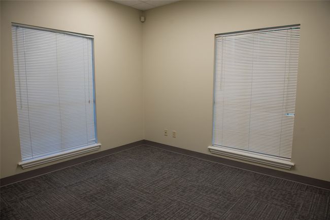 Spare room with dark carpet | Image 21