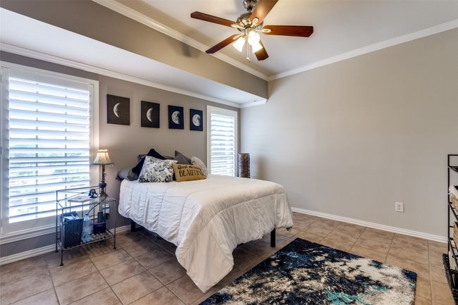 Spacious, light & bright Bedroom featuring crown molding, baseboards, ceiling fan | Image 9