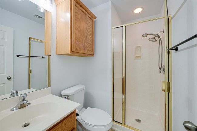 Bathroom with a shower stall and vanity | Image 18
