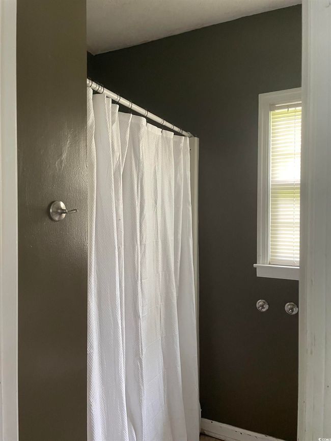 Bathroom with a shower with curtain | Image 23