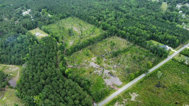 View of property location featuring a heavily wooded area and property parcel outlined | Image 5