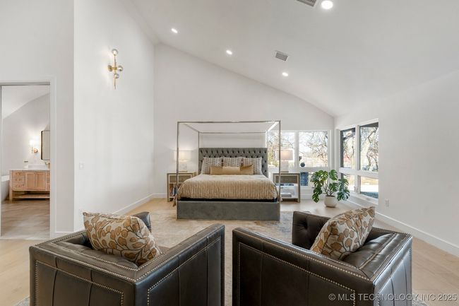 Huge primary suite with floor to ceiling stucco fireplace | Image 45