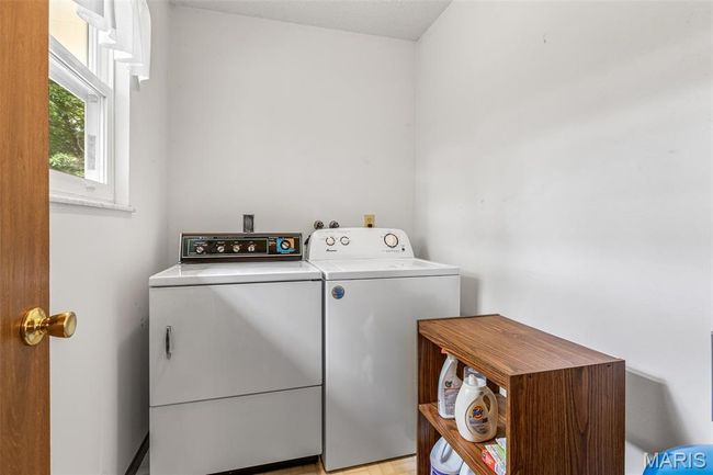 Washroom with washer and clothes dryer | Image 24