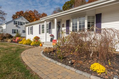 Belgian block pavers form a perfect path to the entrance. | Image 3